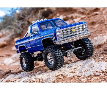 Traxxas TRX-4M High Trail Edition Crawler with Chevrolet K10 Pickup Body (Blue): 1/18-Scale 4X4 Electric Trail Truck. Ready-To-Drive with TQ 2.4GHz 2-Channel Transmitter and ECM-2.5™ Waterproof Electronics. In Store Sales Start August 25th; Online Sales B